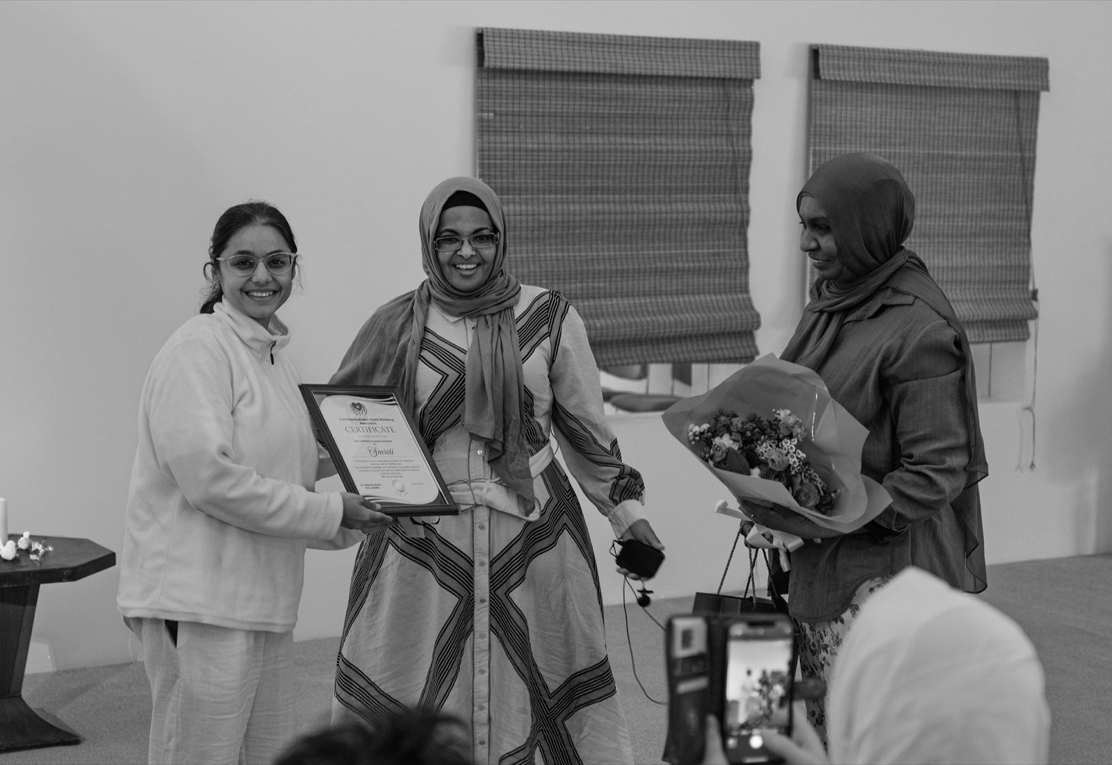 Smriti Budhia receiving a certificate of appreciation from organisers