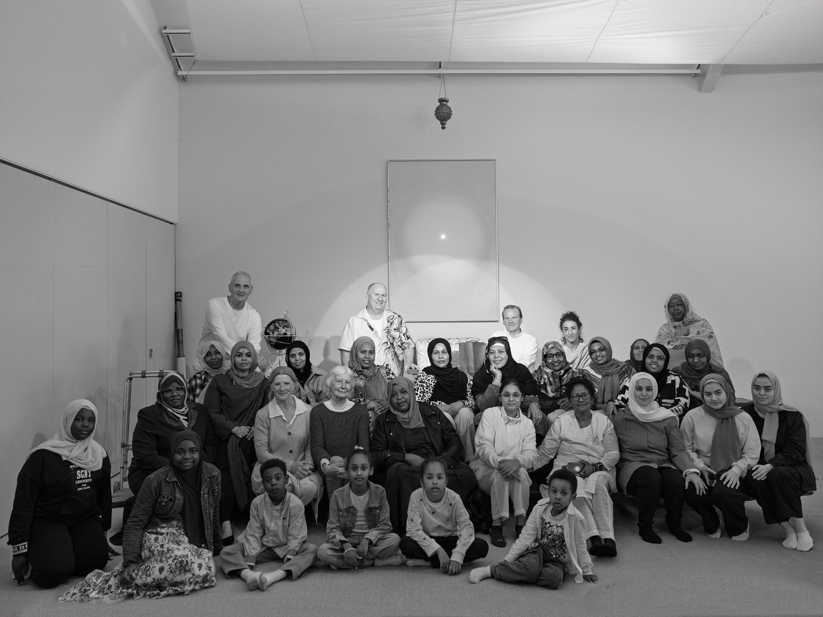 A large group portrait of retreat participants and facilitators