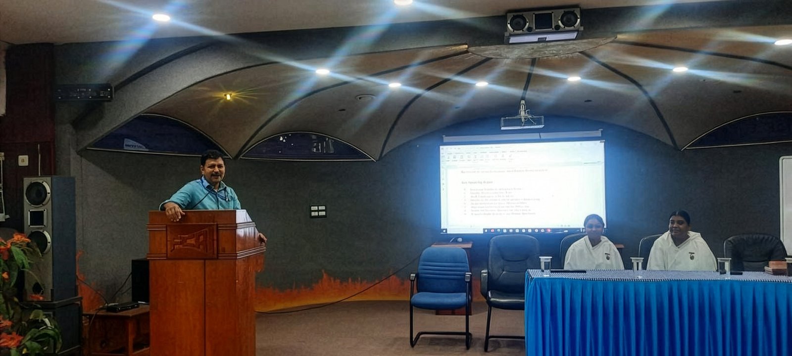 A speaker addressing an auditorium at Fluid Control Research Institute, Kanjikode, Kerala