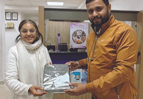 A certificate of appreciation being presented to Smriti Budhia by Utkarsh Small Finance Bank for conducting meditation session for mental well-being of bank staff